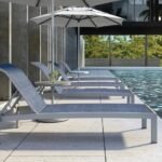 Castelle Orion Adjustable Sling Chaise Lounge with Platinum Tex Finish and Augustine Denim Sling